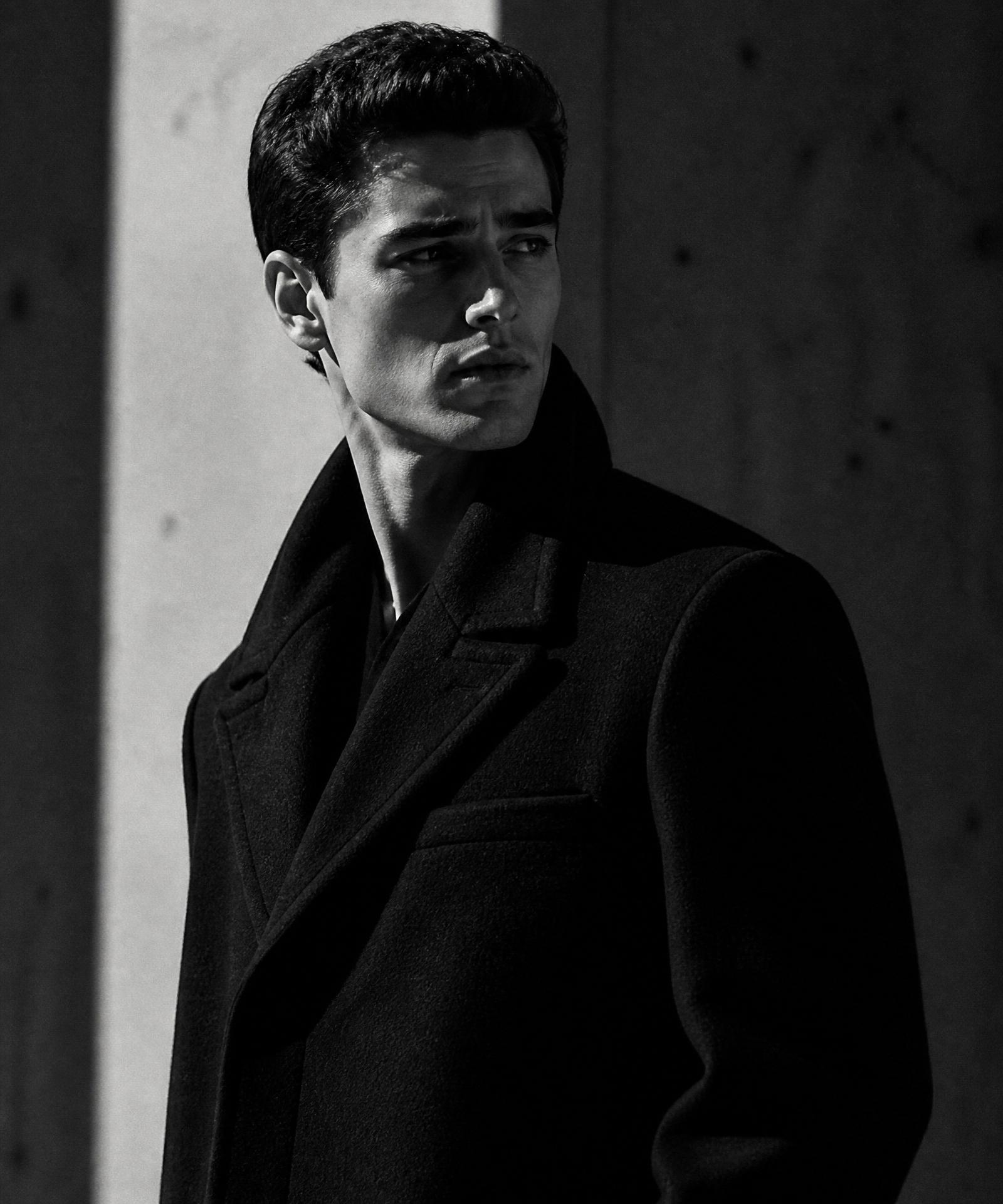 Keanu Zeller editorial portrait in black wool overcoat
